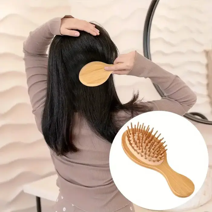 Peigne à coussin d'air en bois de bambou avec poils de Massage