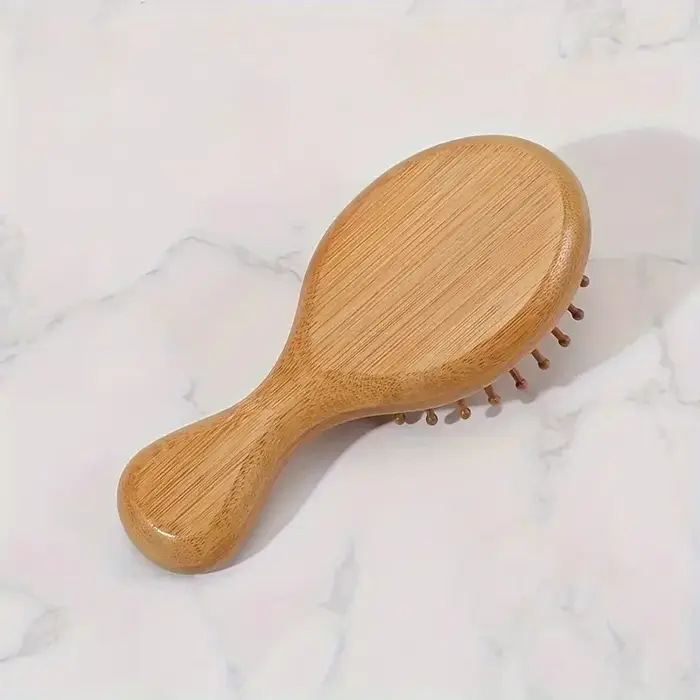 Peigne à coussin d'air en bois de bambou avec poils de Massage