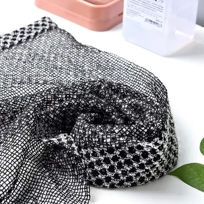 Serviette à friction pour prendre une douche