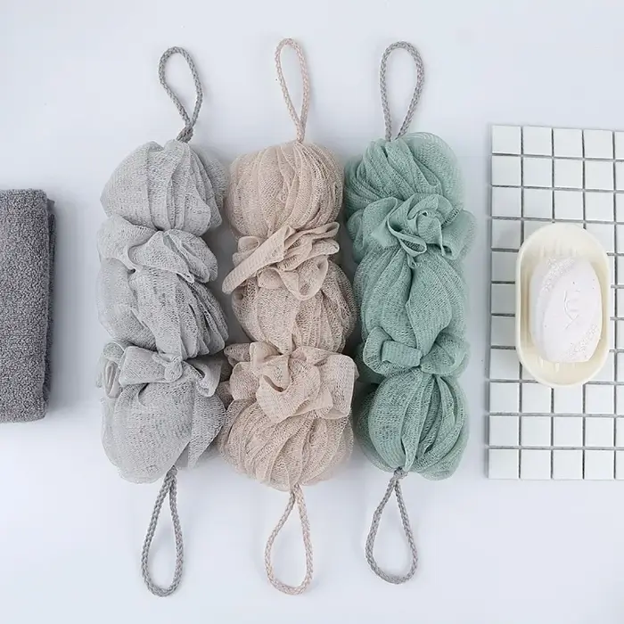 Brosse exfoliante en maille pour le corps