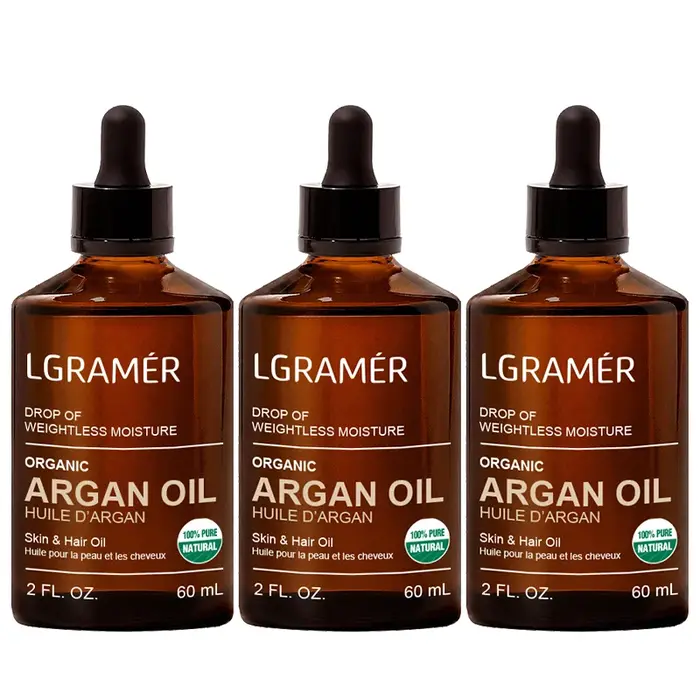 Huile de massage 100% pure pressée à froid d'argan, de rose musquée et de jojoba pour nourrir les cheveux secs, hydrater la peau et la rendre éclatante. Soin quotidien pour le visage et les cheveux.